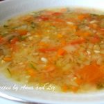 A bowl of vegetable soup served in a white bowl.