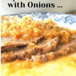 A serving of sliced meat with smothered onions on top.