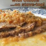 A serving of sliced meat with caramelized onions on top served on a white and blue plate.