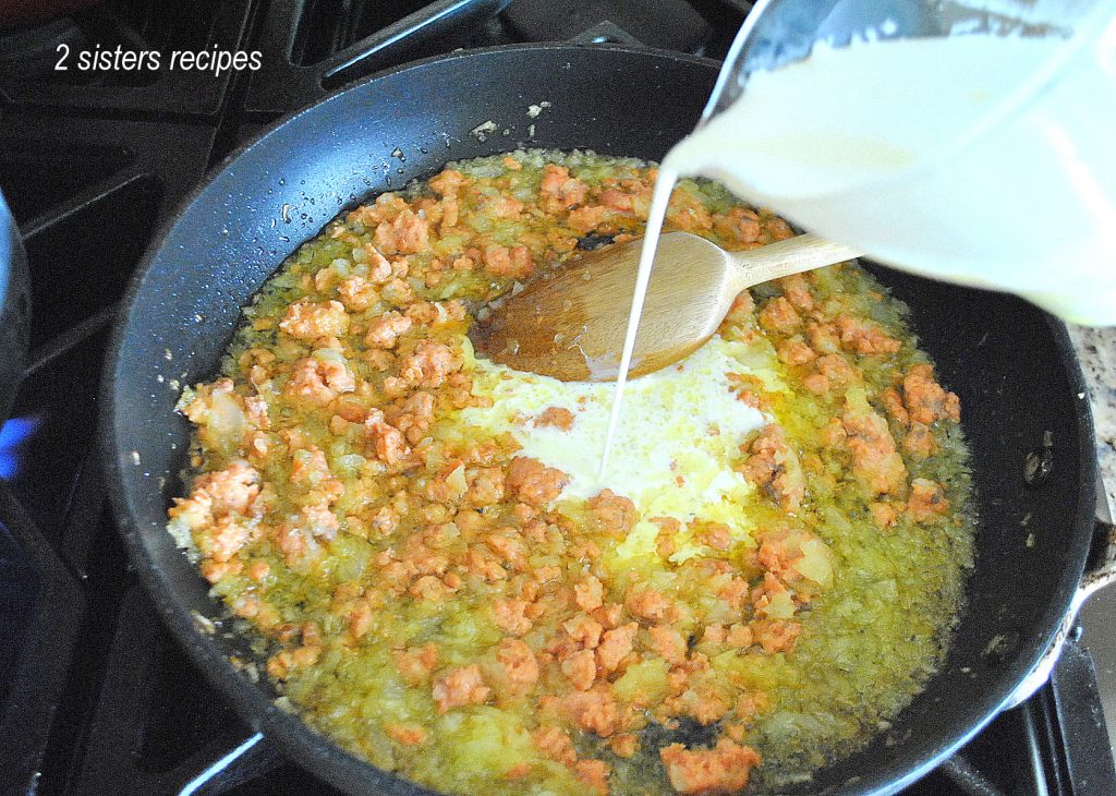 Cream is poured into the salmon mixture by 2sistersrecipes.com 