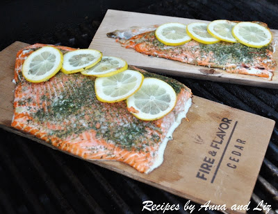 Grilled Wild Alaskan Salmon on Fire & Flavor Cedar Planks with only herbs and lemon gives an incredible smoky flavor to this fresh salmon. by 2sistersrecipes.com