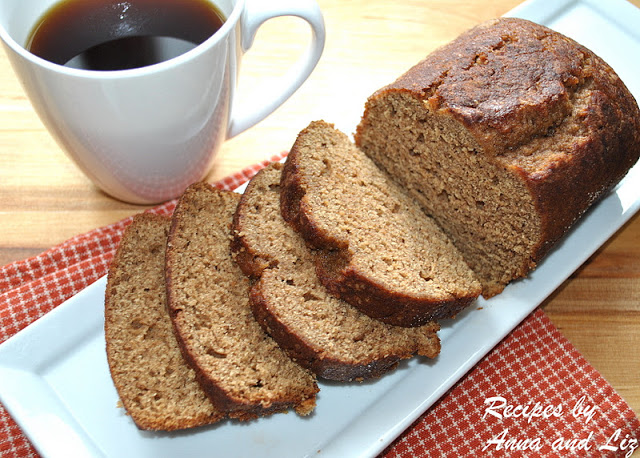 Sliced pumpkin bread is served with a cup of coffee. by 2sistersrecipes.com 