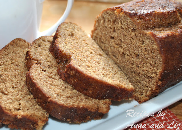 The bread is sliced on a white platter. by 2sistersrecipes.com 