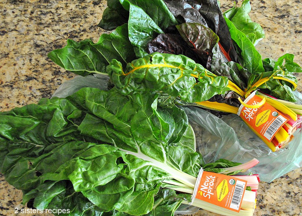 2 bundles of Fresh Swiss Chard on the counter. by 2sistersrecipes.com