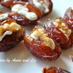 Close up photo of dates filled with cheese and walnuts.
