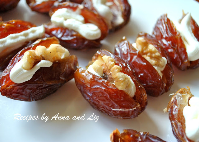 Close up photo of dates filled with cheese and walnuts. by 2sistersrecipescom