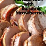 A pork tenderloin is grilled and sliced, served on a platter.