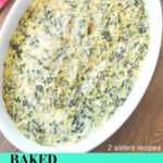 A white oval baking dish with a artichoke and spinach dip.