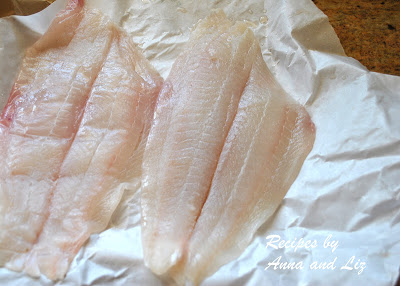 Phjoto of raw fish on wax paper. by 2sistersrecipes.com