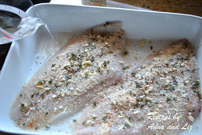 White wine is poured into the baking dish with the flounder. by 2sistersrecipes.com 