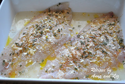 Photo of flounder in a bath of lemon and wine. by 2sistersrecipes.com 