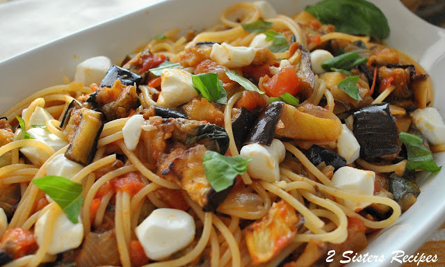 Most popular eggplant recipes witha bowl of spaghetti tossed with cubes of Eggplant Fresh Tomatoes and mozzarella by 2sistersrecipes.com