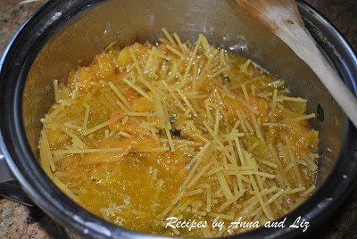 broken spaghetti added to the pot with the Calabasa squash by 2sistersrecipes.com 