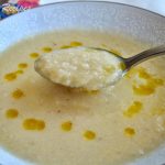 A spoonful of creamy potato and cauliflower soup.