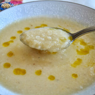 A spoonful of creamy potato and cauliflower soup.