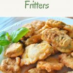 A white serving plate filled with artichoke heart fritters.