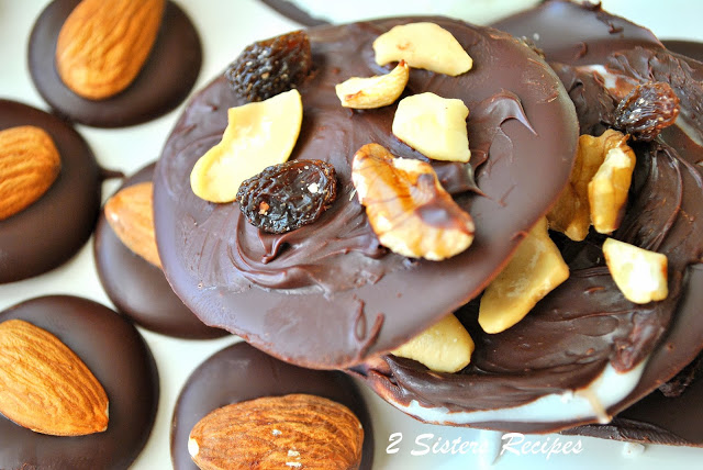  A photo of dark chocolate barks covered with mixed nuts and raisins. by 2sistersrecipes.com 