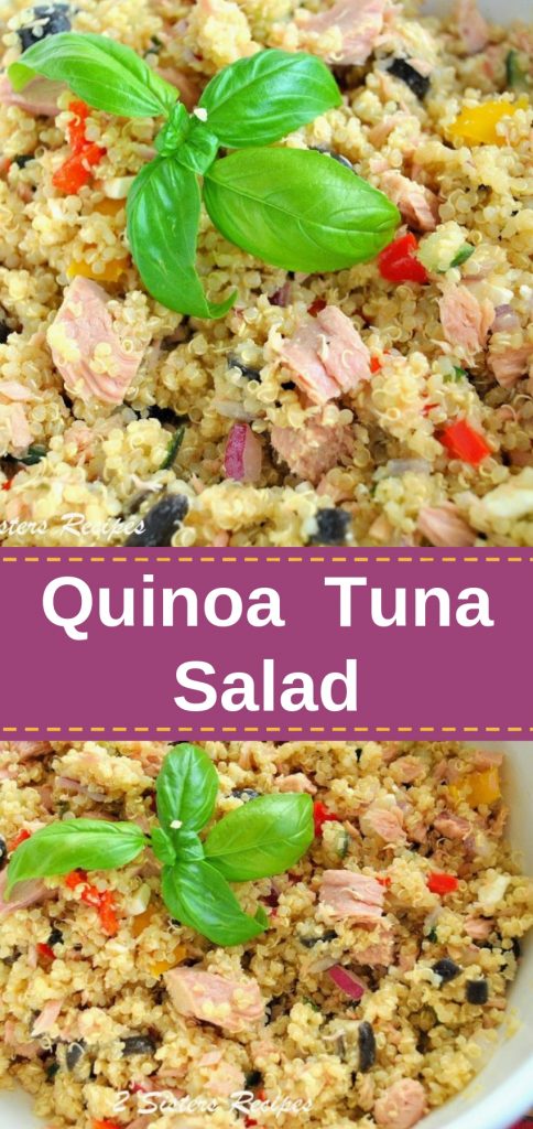 A bowl of quinoa salad with tuna and mix veggies with fresh basil leaves on top. 