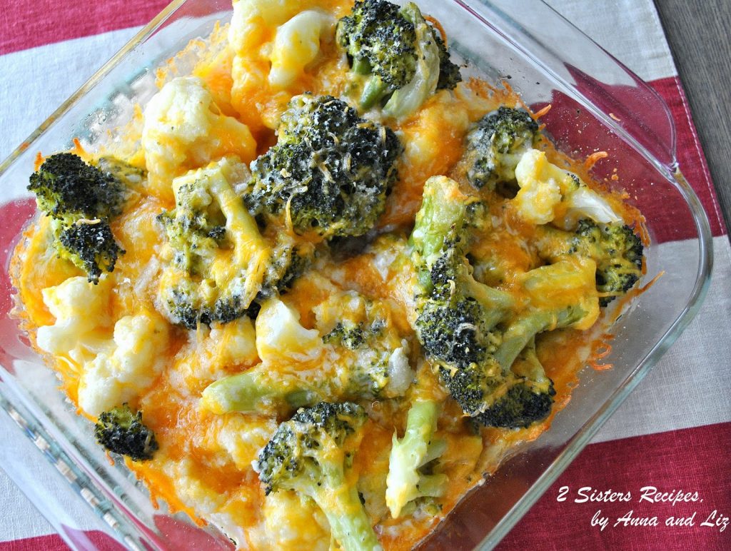 Baked Kale Broccoli Cauliflower dish with melted cheddar  cheese on top. 