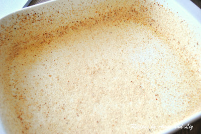 white baking dish coated with breadcrumbs by 2sistersrecipes.com 