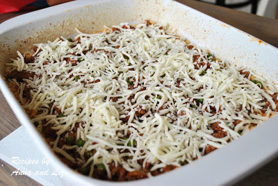 Baking dish with the shredded mozzarella sprinkled on top. by 2sistersrecipes.com 