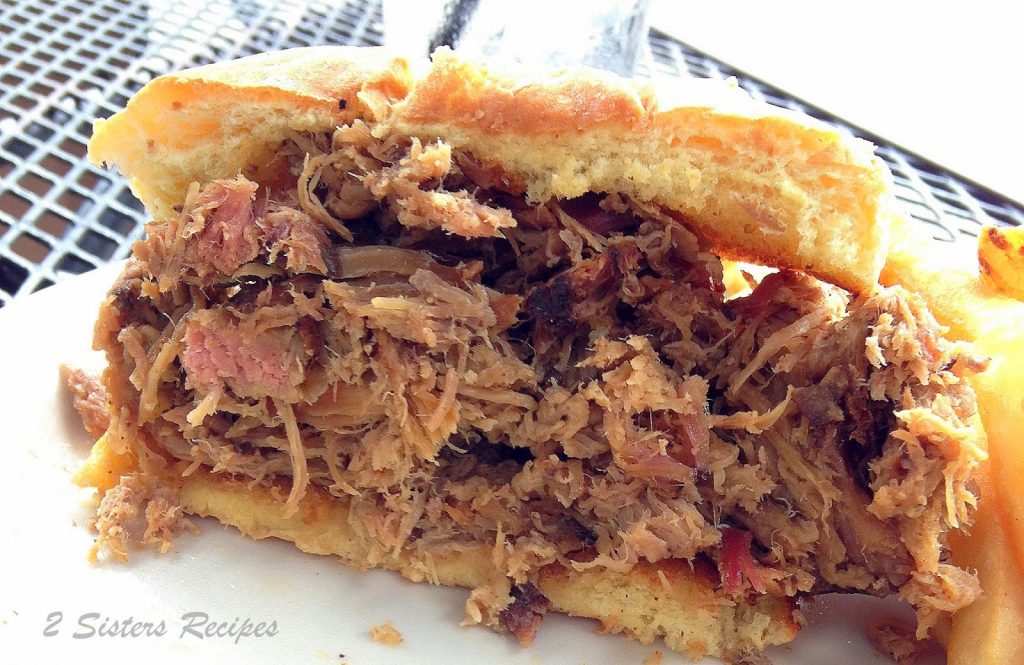 Easy Oven-Braised Pulled Pork Sandwiches by 2sistersrecipes.com