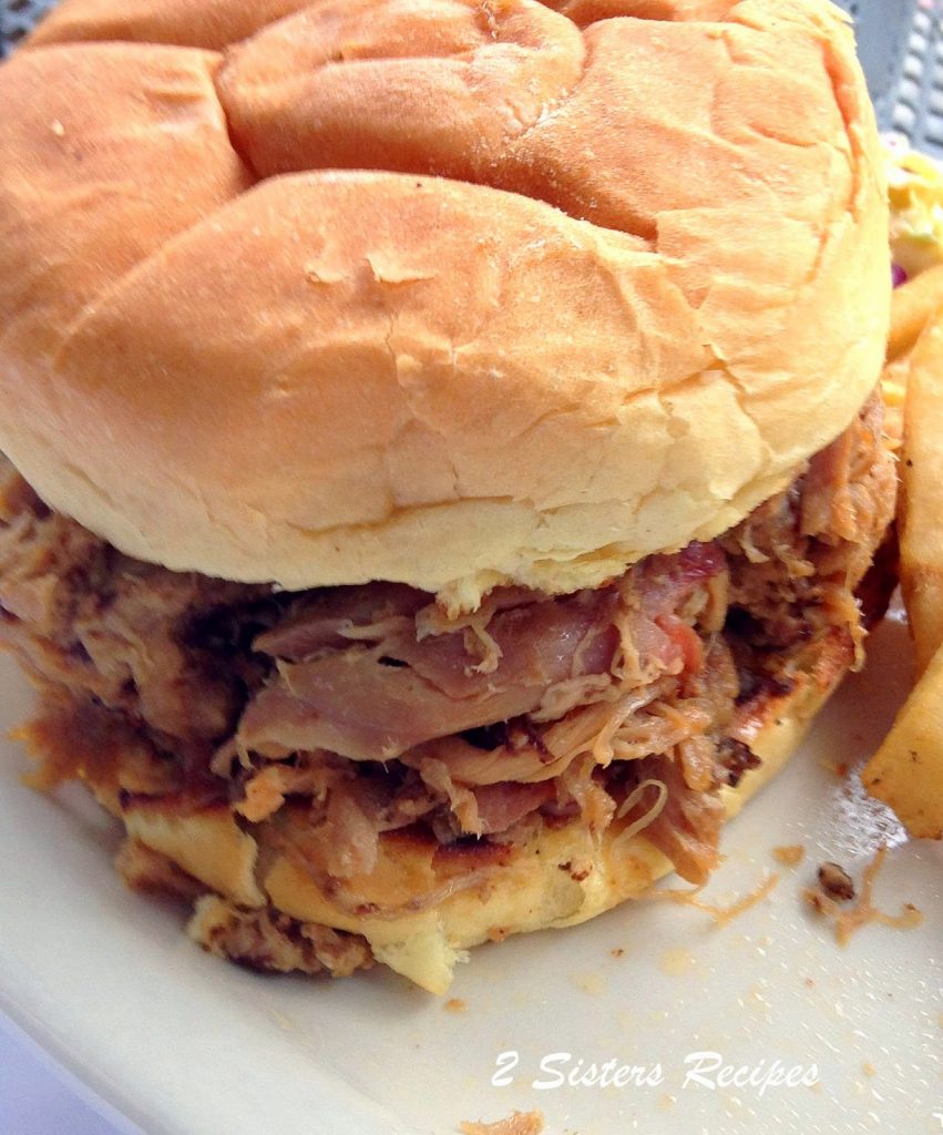 Easy Oven-Braised Pulled Pork Sandwiches by 2sistersrecipes.com 