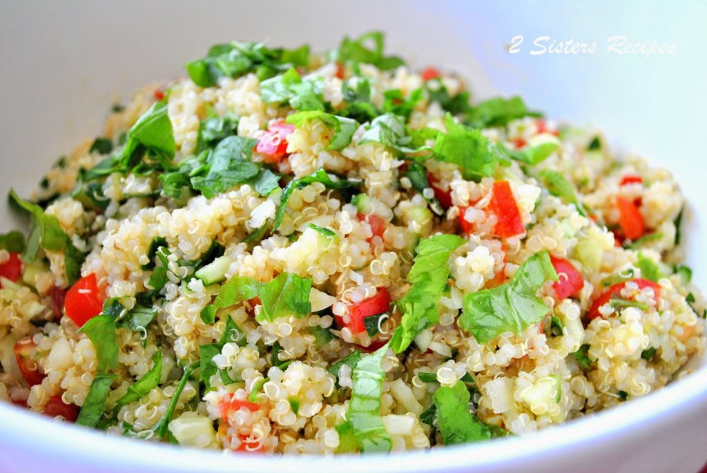  White bowl loaded with this Tabbouleh Salad by 2sistersrecipes.com 