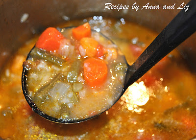 A pot of vegetable soup on the stove by 2sistersrecipes.com 