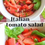 A white salad bowl filled with sliced fresh tomatoes, red onions and fresh basil.