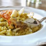 a forkful of fried cod with pesto risotto. by 2sistersrecipes.com