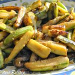 A serving colorful platter with sautéed zucchini sticks.