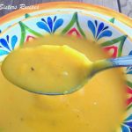 A spoonful of creamy butternut squash soup.