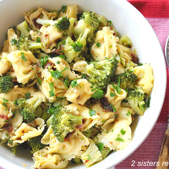 Tortellini and Broccoli Salad served in a white salad bowl.