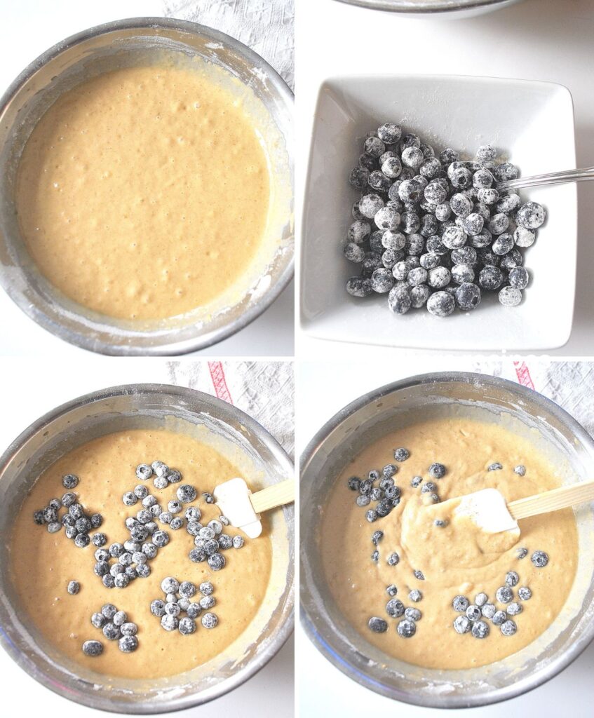 A large mixing bowl with mixture, a white bowl with blueberries coated with flour, and folded into the mixture.
