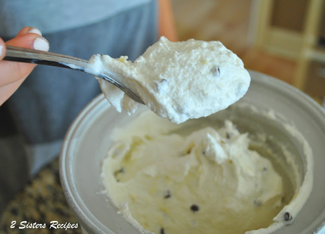 A scoop on a spoon of the ice cream. by 2sistersrecipes.com