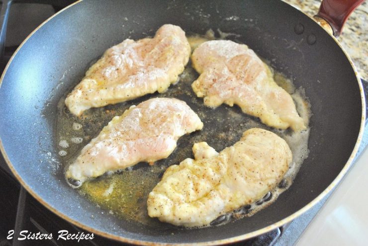 Chicken sauteed in a skillet on stovetop. by 2sistersrecipes.com 