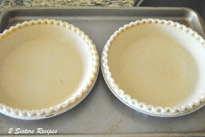 2 frozen pie crusts on a baking pan by 2sistersrecipes.com 