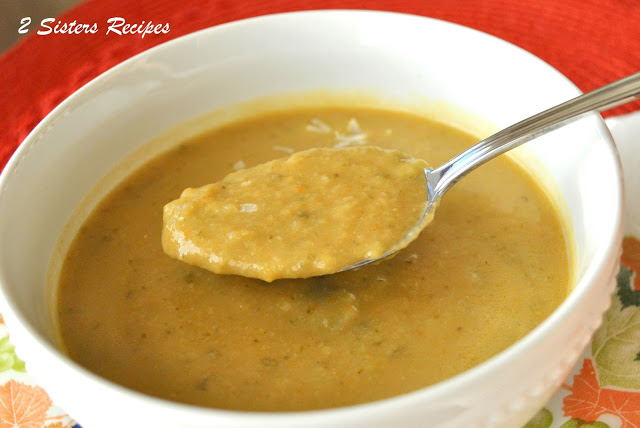 A spponful of creamy vegetable soup. by 2sistersrecipes.com