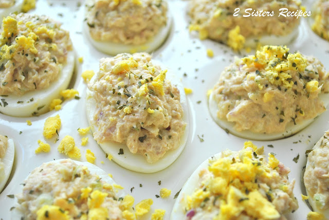 An easy party appetizers like our Wasabi Tuna Deviled Eggs served in a white platter. by 2sistersrecipes.com