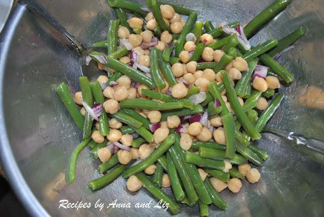 A silver mixing bowl with green beans and chickpeas. by 2sistersrecipes.com 