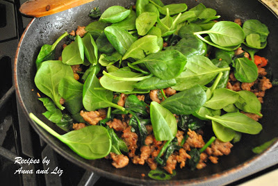 Fresh baby spinach is added to the skillet with crumbled sausages. by 2sistersrecipes.com