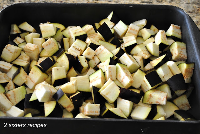 Chopped eggplant in a large roasting pan. by 2sistersrecipes.com