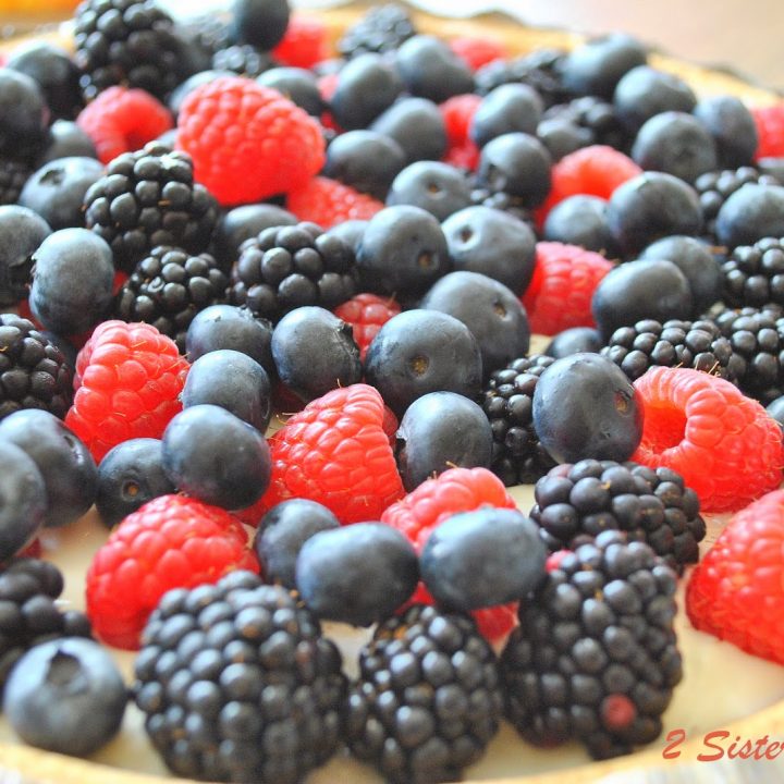 A pie with mixed berries covering the top.