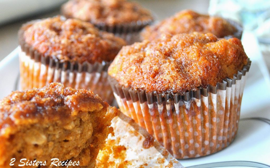 Baked muffins on a white serving platter. 