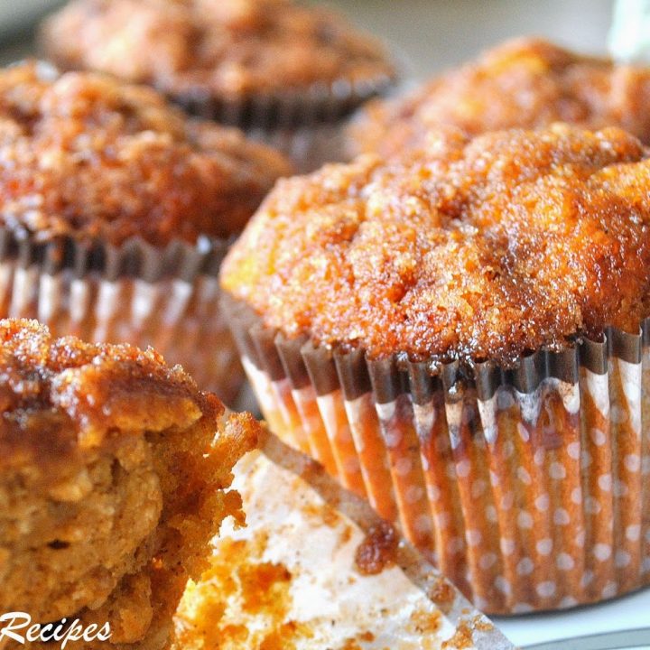 Baked muffins on a white serving platter.