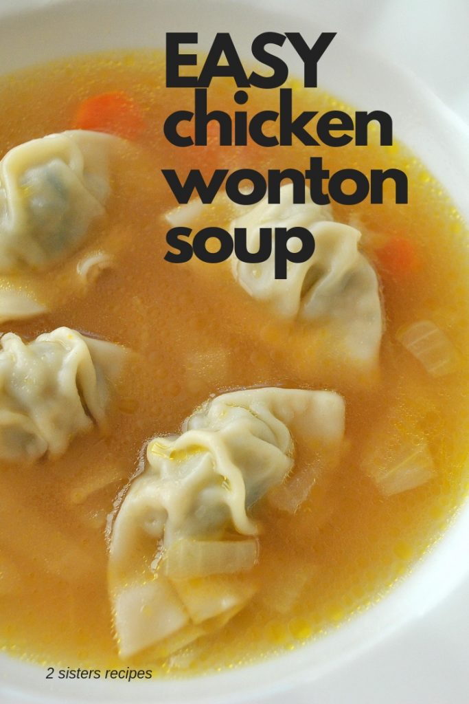 A white soup bowl filled with chicken broth and mini wontons. 