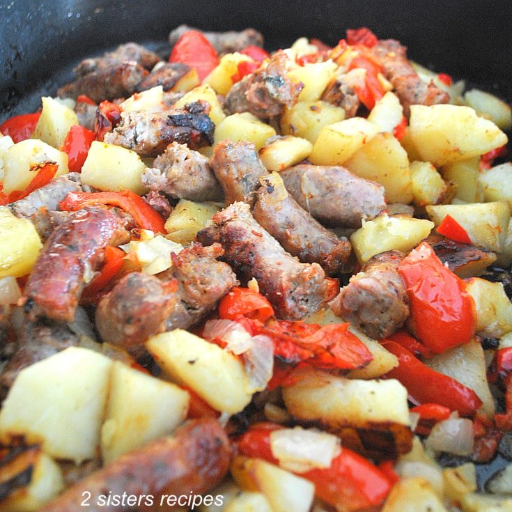Oven-Baked Thin Sweet Sausages with red peppers and potato casserole. by 2sistersrecipes.com