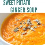 A white bowl filled with a thick, creamy carrot soup.