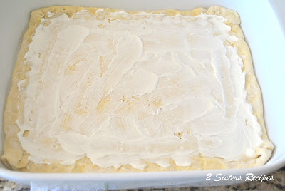 Mayonnaise is spread on the bottom of the pastry sheet in a baking dish. by 2sistersrecipes.com. 